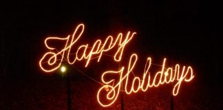 light up neon saying happy holidays