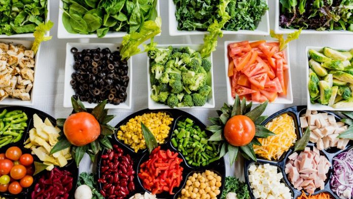 Spread of many fruits and vegetables in bowls