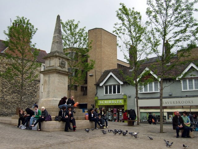Photo of Bonn Square in Oxford with people sitting on the Tirah monument