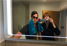 Photo of two friends shaving, one is a cardboard cut-out.