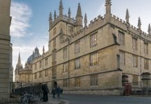 An Oxford building against a light blue sky.