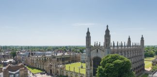Cambridge from above, with old buildings and green fields.