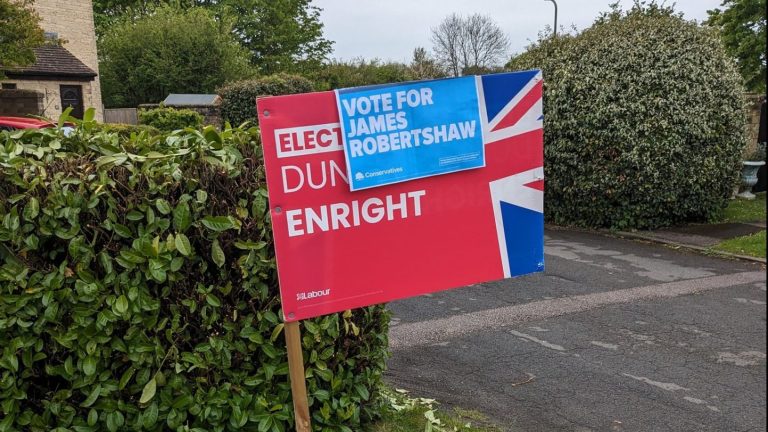 OUCA members accused of defacing campaign sign in garden of local official