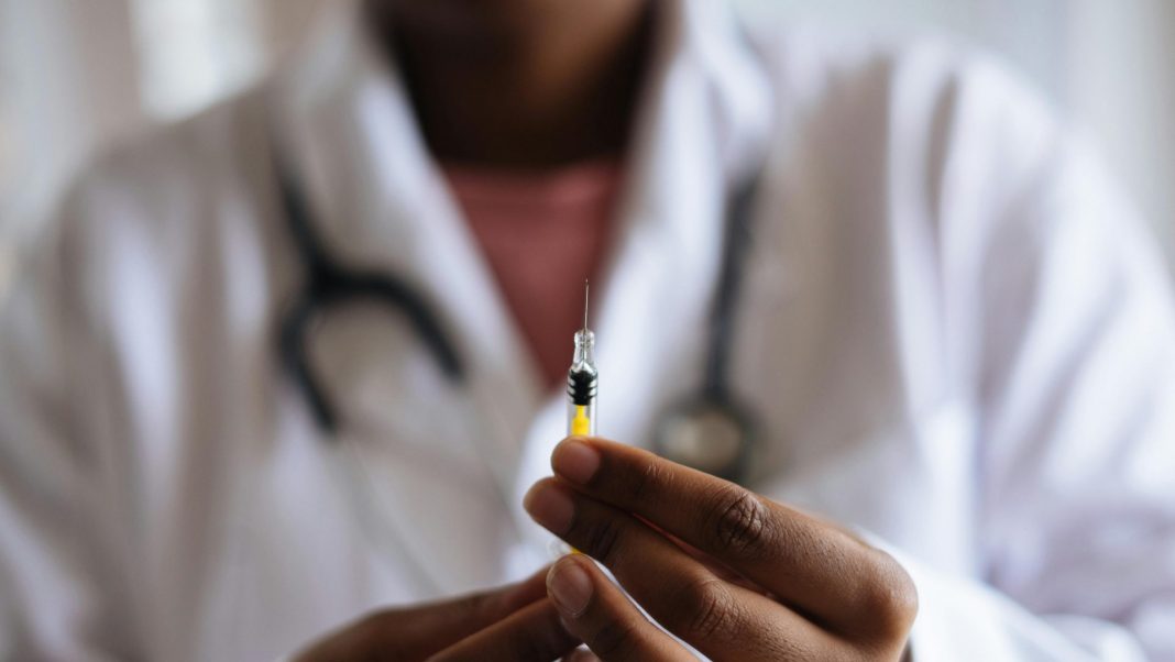 Picture of a person holding a vaccine